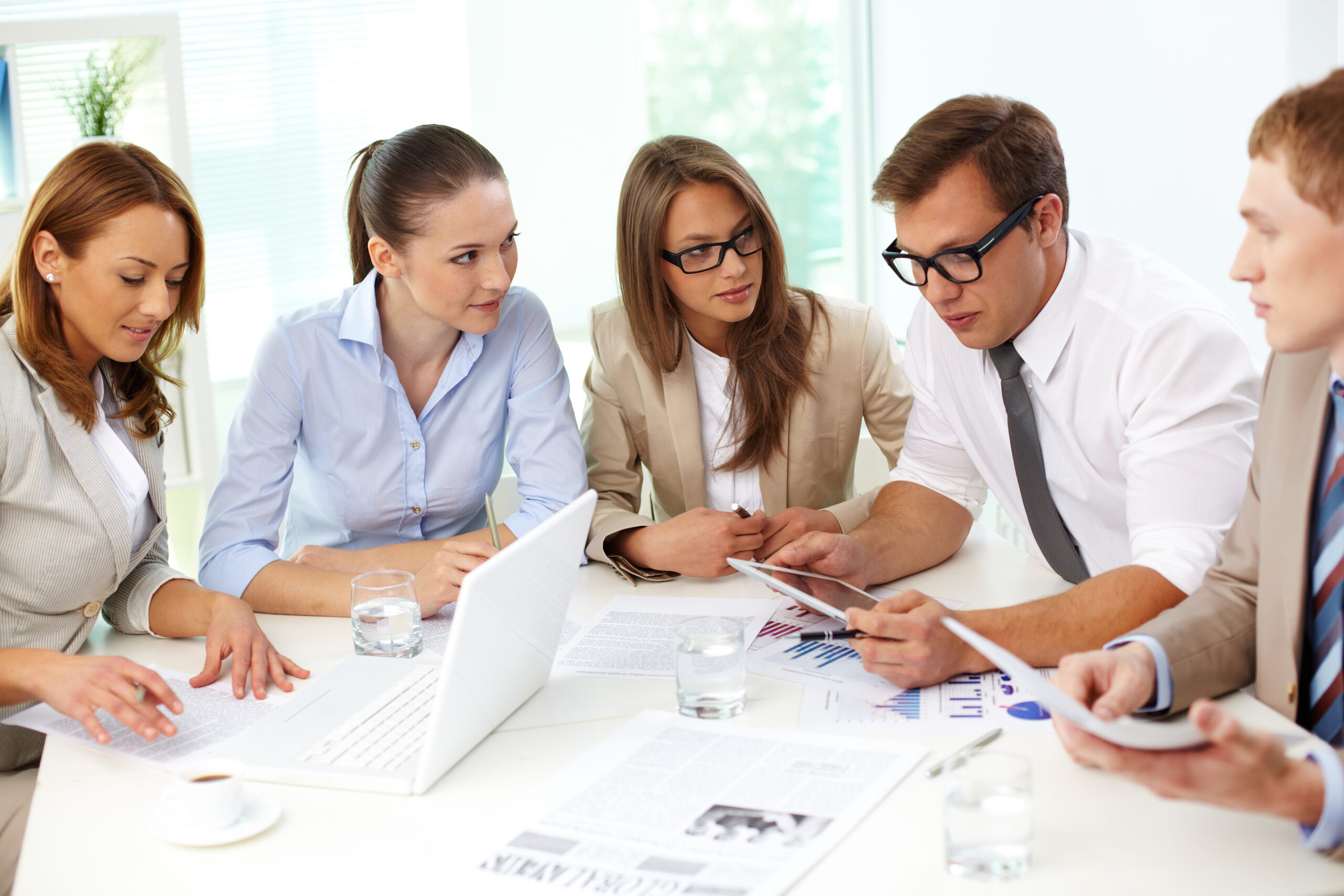 Cooperative colleagues Business colleagues analyzing the results of the financial period together